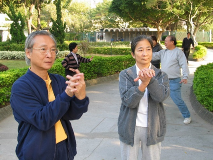 Two elderly are doing Tai Chi activities to keep well-being.